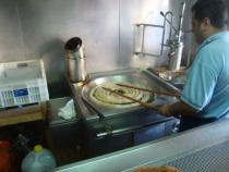 Churros cooking in oil in Caceres, Spain